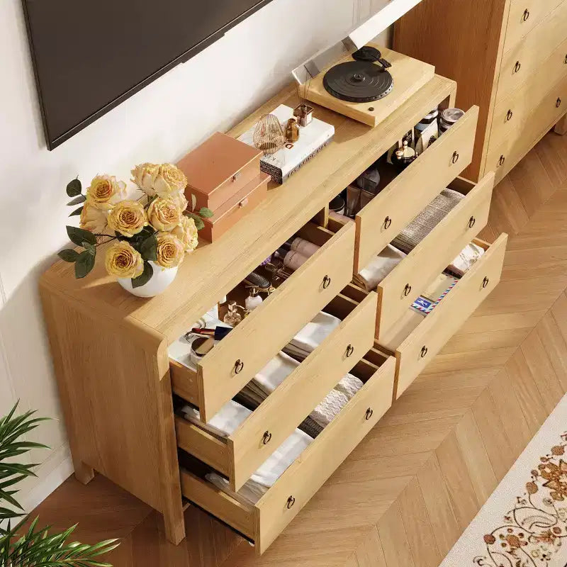 Commode moderne à 7 tiroirs – Aspect bois, poignées métalliques, bords arrondis